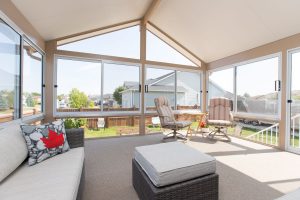 Even though we're sitting inside the sunroom, the yard is still connected to the environment