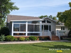 White studio sunroom with treated wood deck and white aluminum picket railings East st Paul 2