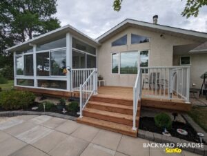White studio sunroom with treated wood deck and white aluminum picket railings East st Paul 4