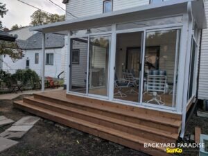 White studio sunroom with wrap around stadium staircase and covered deck , River Heights, Winnipeg , Manitoba 1