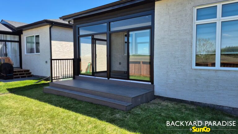 black curtain wall sunroom with composite deck and black aluminum rail headingley manitoba