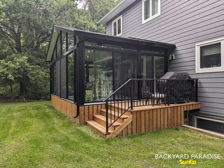 Black gable sunroom with black aluminum railings installed in La-Salle, Manitoba.