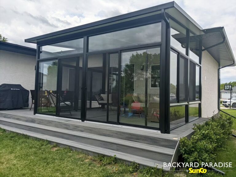 Black studio sunroom on composite deck installed in Stonewall, Manitoba