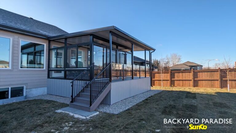 Black studio sunroom with composite deck and black aluminum rail built in Headingley, Manitoba