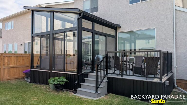 Black studio sunroom with composite deck and black aluminum railings installed in Sage Creek, Winnipeg