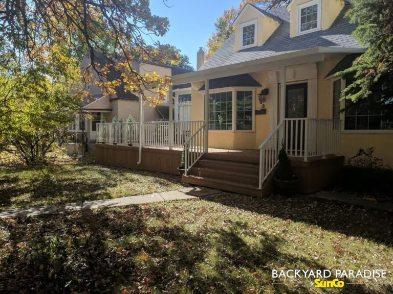 Covered deck with white aluminum picket railings built in St James, Winnipeg