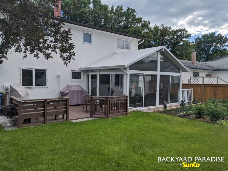 White gable sunroom on ground level installed by SunCo in Westwood, Winnipeg