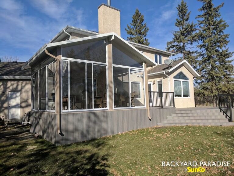 Sandalwood and white custom sunroom with composite deck installed in Headingley, Manitoba.