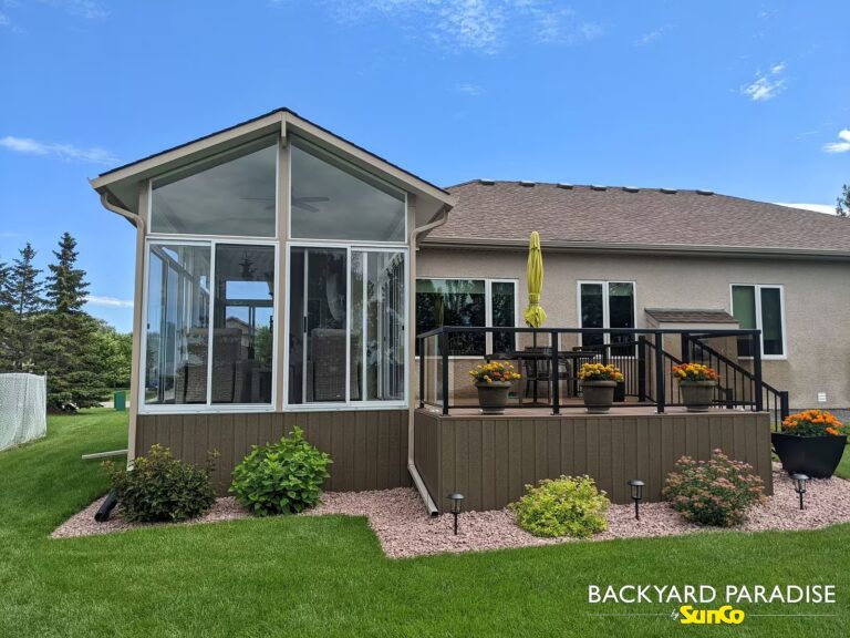 Sandalwood and white gable sunroom with composite deck installed in La Salle, Manitoba